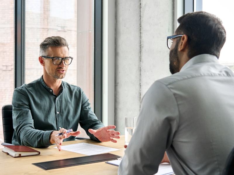 two males discussing financial advisor Business Coaching